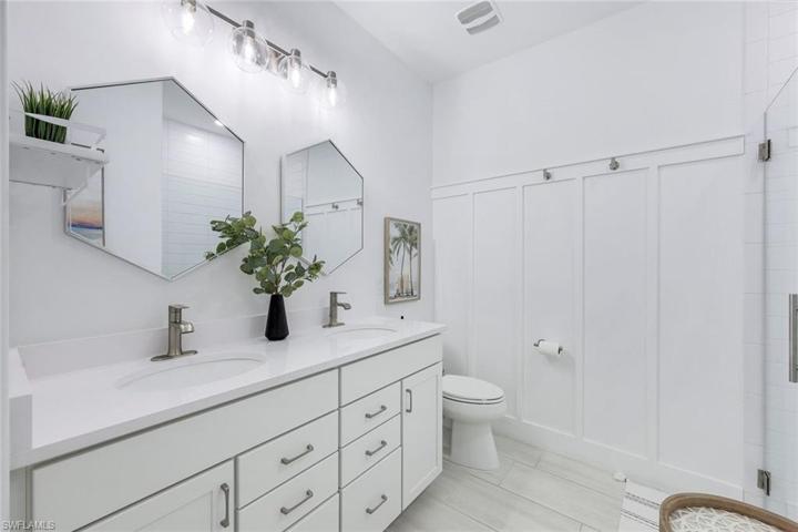 Guest bathroom with dual stinks.