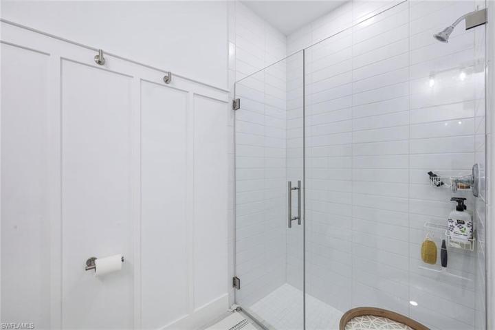 Guest bathroom w/frameless shower.