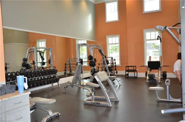 Huge Fitness Center featuring a high ceiling