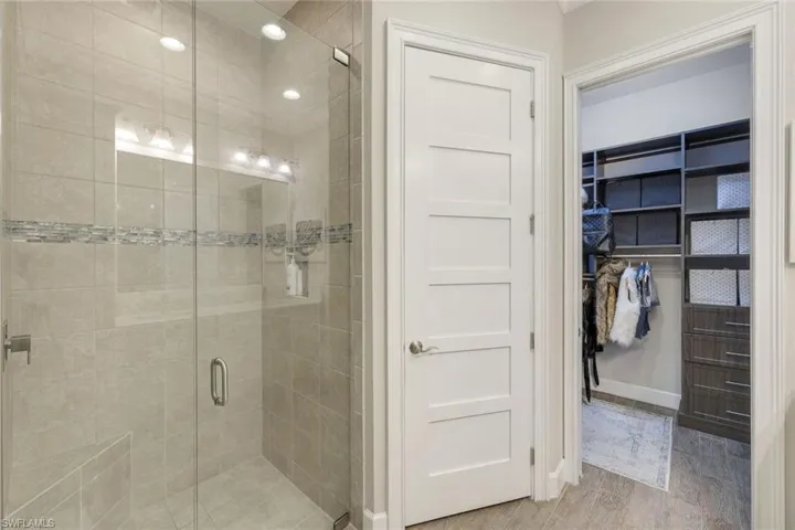 Master Bathroom featuring , a stall shower, and a walk in closet