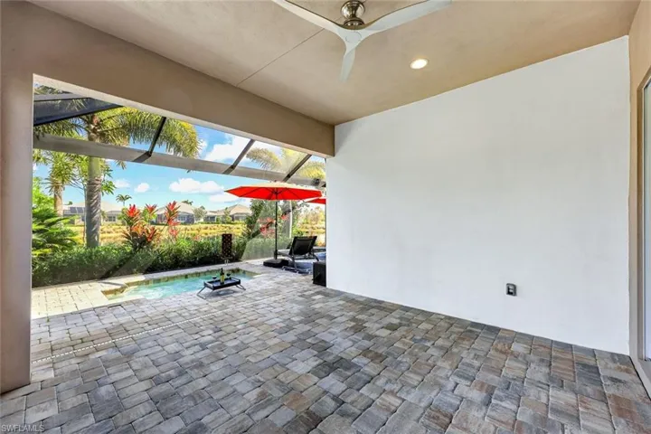 View of patio / terrace with a lanai and an dipping pool