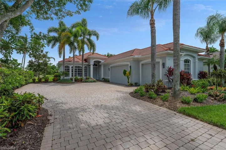 Estate Home Exterior with 3 CAR Attached Garage, Brick Paver Driveway, and Updated Tile Roof