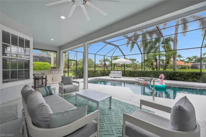 View of Lanai Featuring Ceiling Fan, an Outdoor Living space, and Outdoor Kitchen