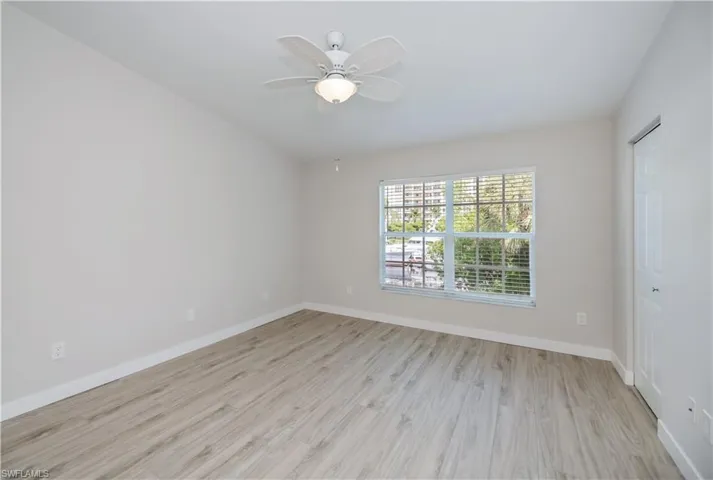Unfurnished room with light wood-style floors and a ceiling fan