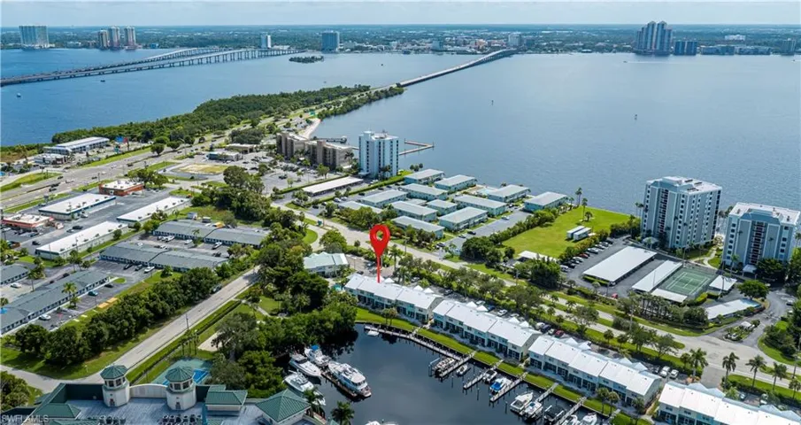 View of urban area with a large body of water and a notable bridge