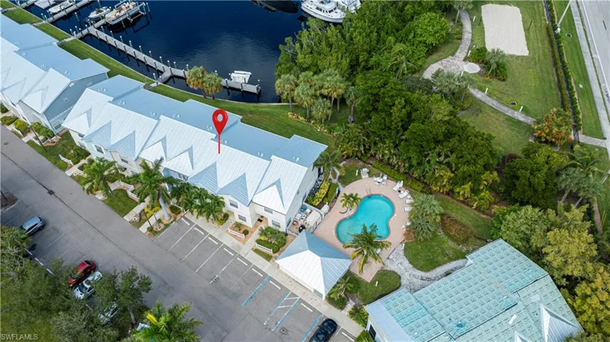 Aerial view of a nearby body of water and a pool area