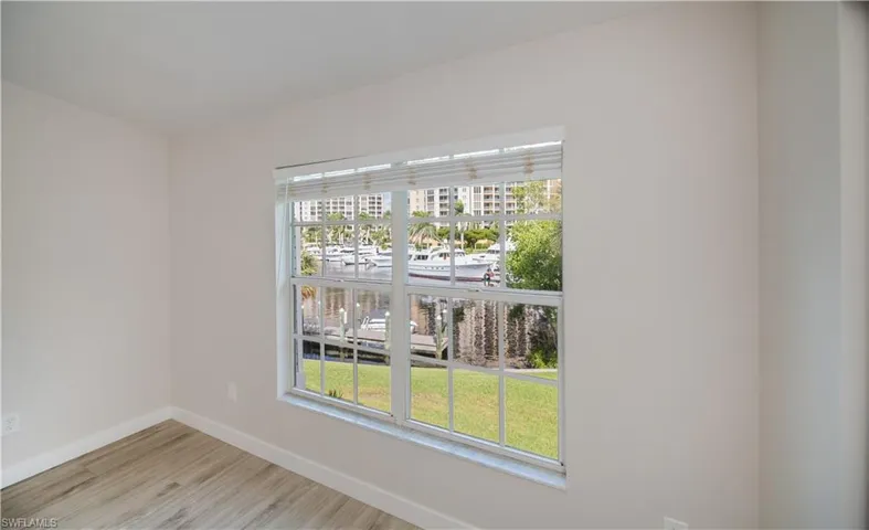 Unfurnished room with baseboards and light wood finished floors
