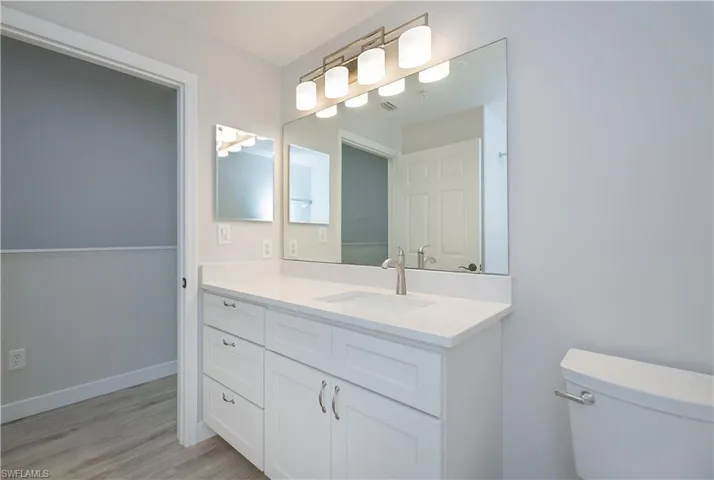 Bathroom with vanity and light wood-style flooring