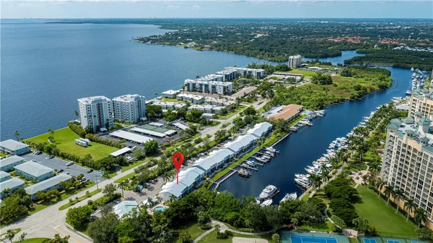 Aerial view of property's location featuring a large body of water