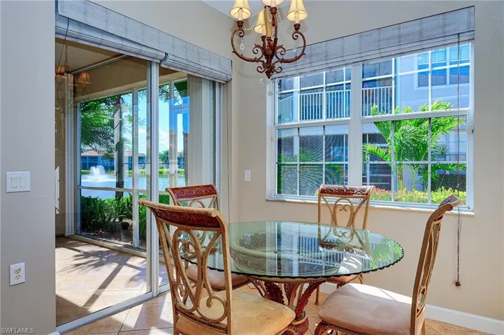 Dining room with a notable chandelier and a healthy amount of sunlight
