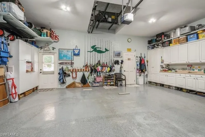 Garage featuring a garage door opener