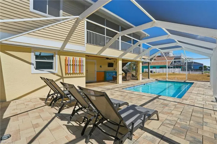 View of Pool, Patio, and Screened-in Lanai - Virtually Edited Image