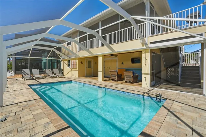 View of Pool, Patio, and Screened-in Lanai - Virtually Edited Image