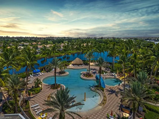 View of swimming pool featuring a water view and a patio
