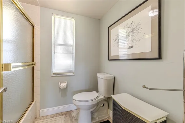 Full bathroom with healthy amount of natural light