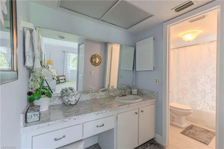 Bathroom with vanity and shower / bath combo