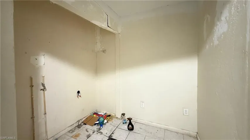 Washroom with light tile patterned floors