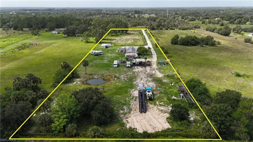 View of rural area with property parcel outlined and agricultural land