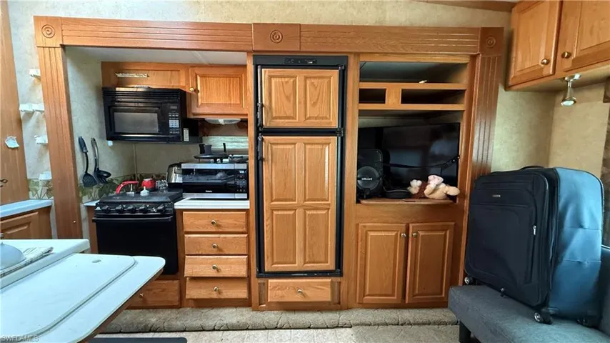 Kitchen with black appliances