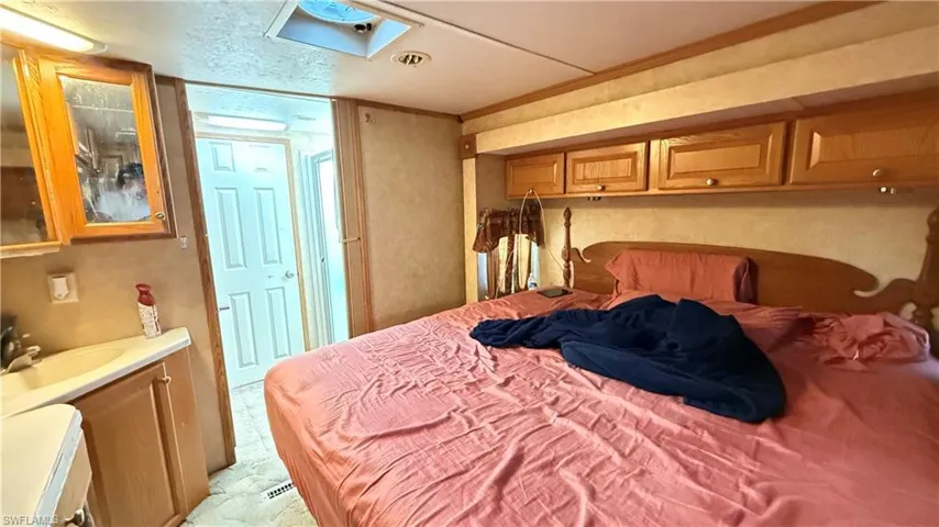 Bedroom with a sink and ornamental molding