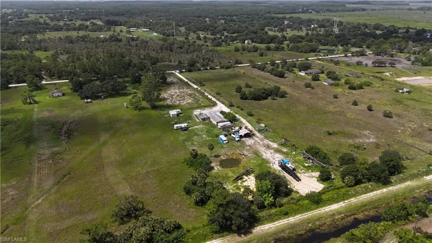 Aerial view of property and surrounding area with rural landscape