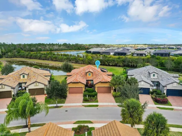 Wide Driveway Leading To 2-Car Garage