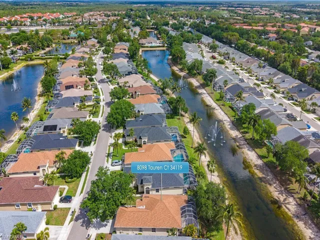 Aerial perspective showcasing a residential community with water features