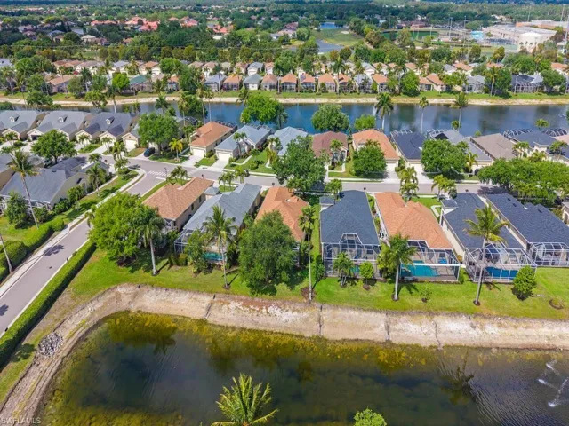 Aerial perspective showcasing a residential community with water features
