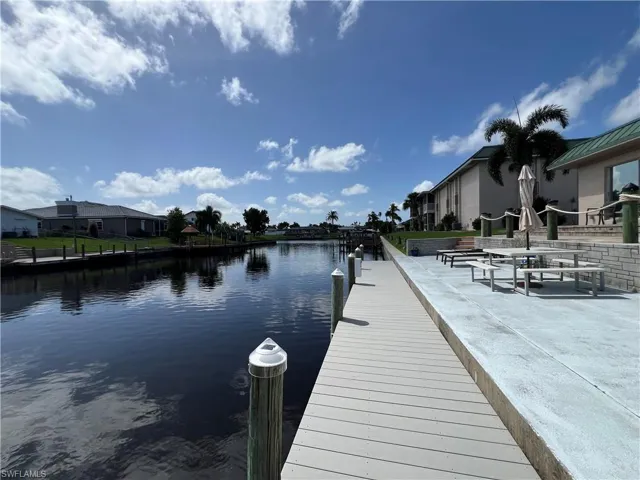 Dock area featuring a water view