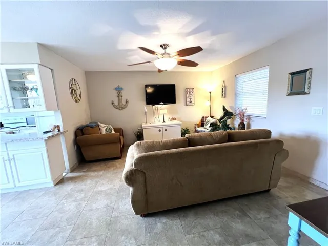 Living room featuring ceiling fan