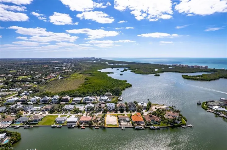 Aerial view of residential area featuring a large body of water