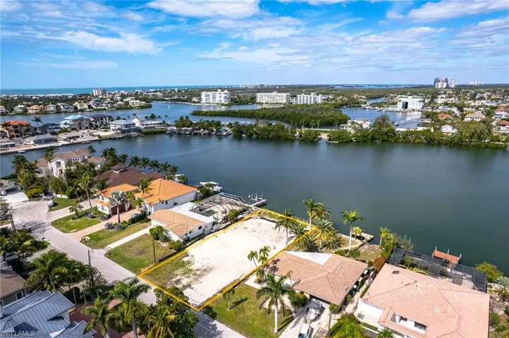 View of urban area featuring a large body of water and nearby suburban area