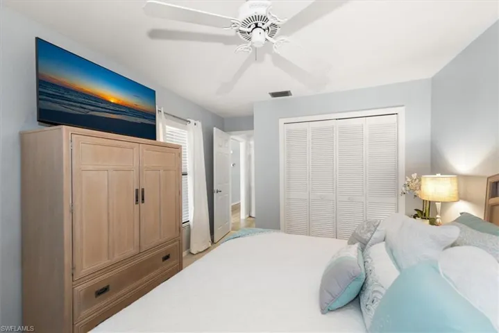 Bedroom featuring a ceiling fan and a closet