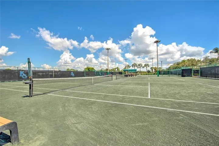 View of tennis court with community basketball court