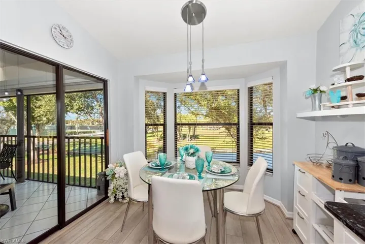 Dining space featuring light wood-style floors and baseboards