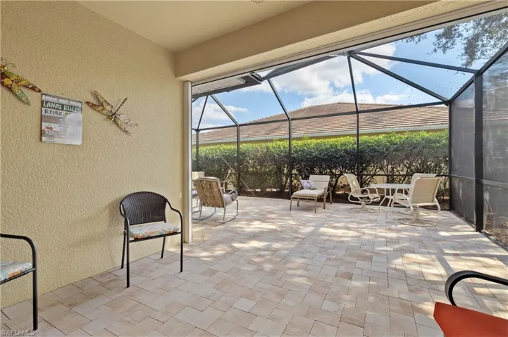 View of patio with a lanai