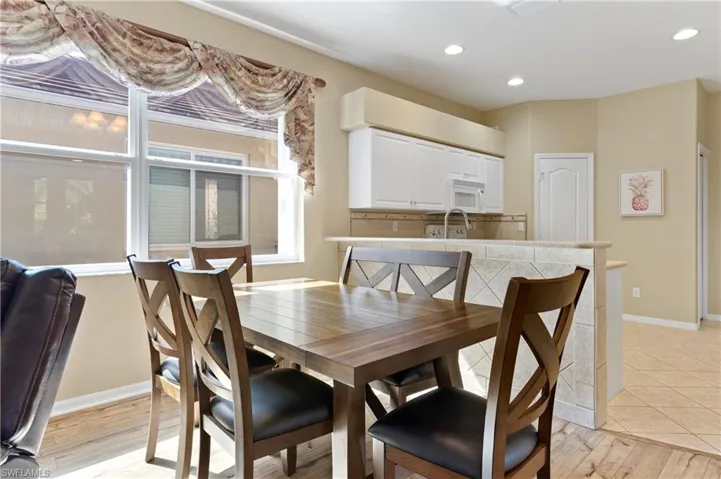 Dining room with light hardwood / wood-style floors