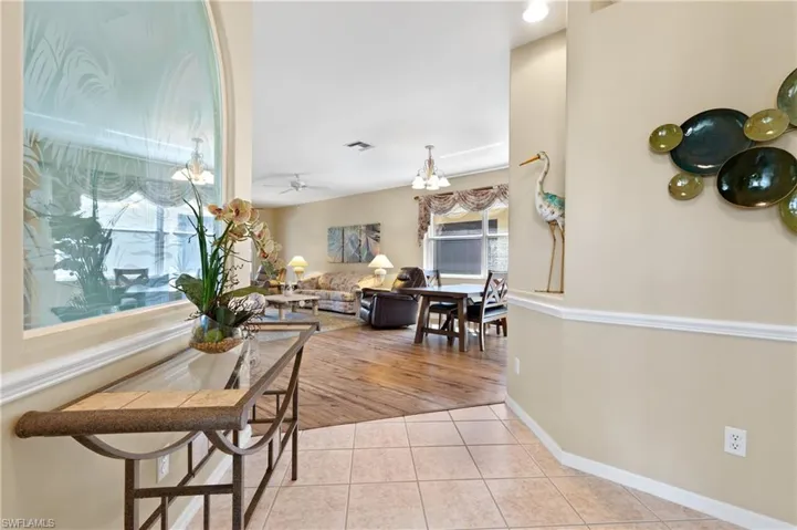 Dining space featuring light tile patterned floors and ceiling fan