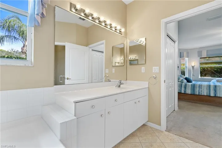 Bathroom with vanity and tile patterned floors