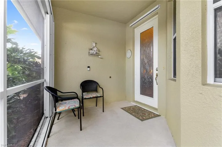 Doorway to property featuring a balcony