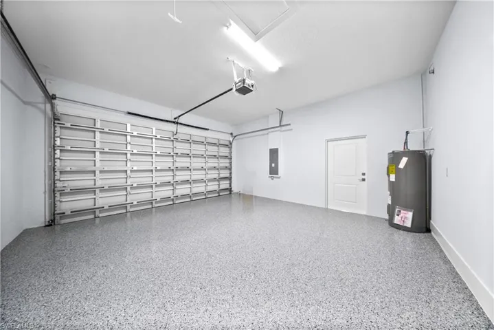 Garage with electric water heater and electric panel