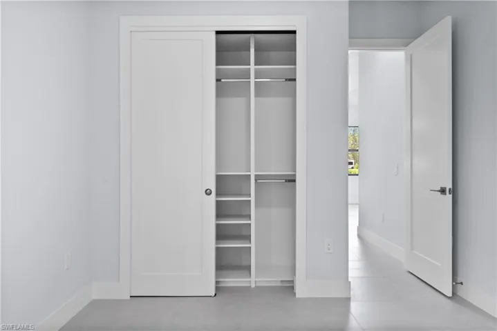 Unfurnished bedroom with baseboards and a closet