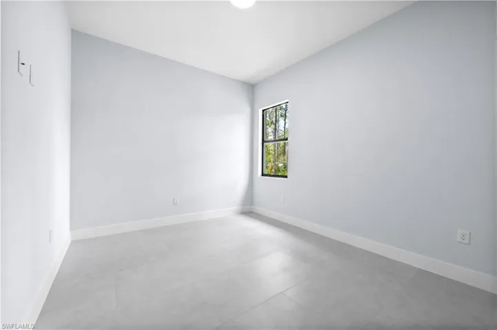 Unfurnished room featuring baseboards