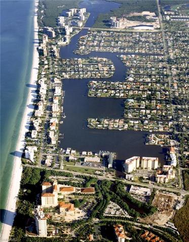 Aerial; The Ritz Carlton in the foreground, Vanderbilt Beach in the middle, and Delnor-Wiggins Pass State Park in the rear