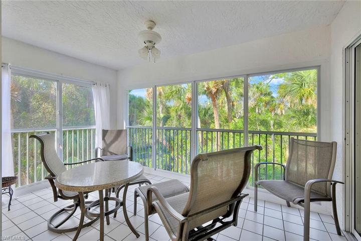 Enclosed Lanai doors open to the breezes, stays cool