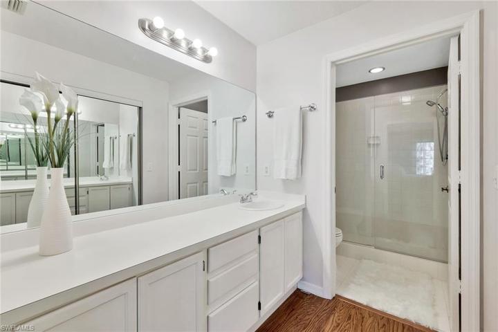 Wood and tile flooring, no carpet, seamless shower doors