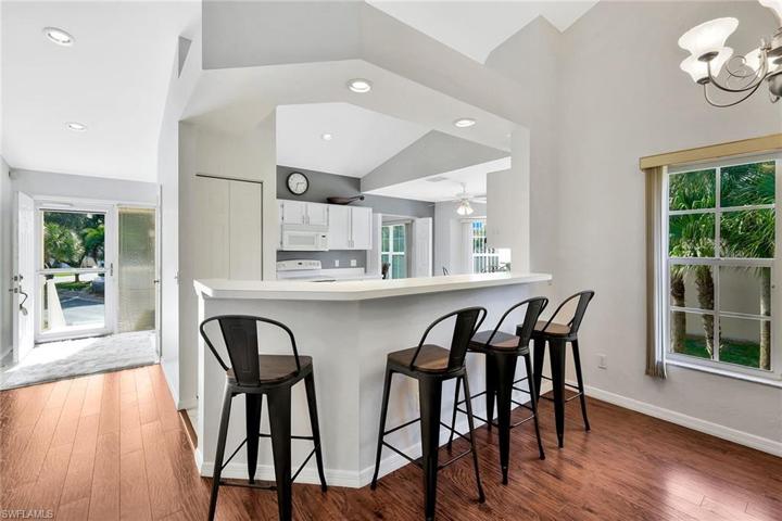Light & bright open Kitchen with generously sized bar - stools included!