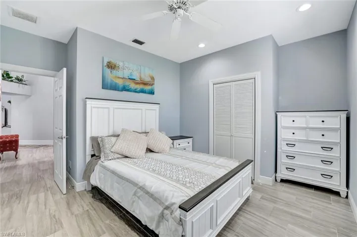 Guest bedroom with tall ceilings.