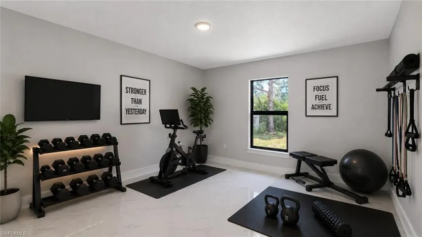 Dedicated exercise room featuring light gray walls and white tile flooring
