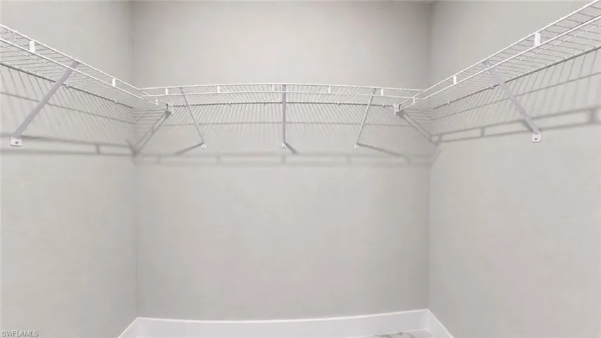 Spacious closet featuring white wire shelving
